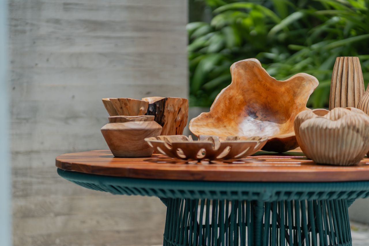 The Art of Drawing Readers In: Your attractive post title goes here A collection of wooden bowls and vases on a rustic table, featuring natural decor and organic design elements.
